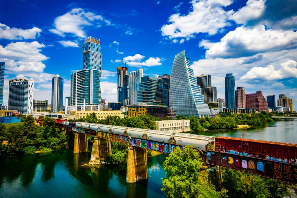 Aerial Drone View over Austin during a Gorgeous Day along the Colorado River or Lady Bird Lake with a perfect Futuristic Skyline Background