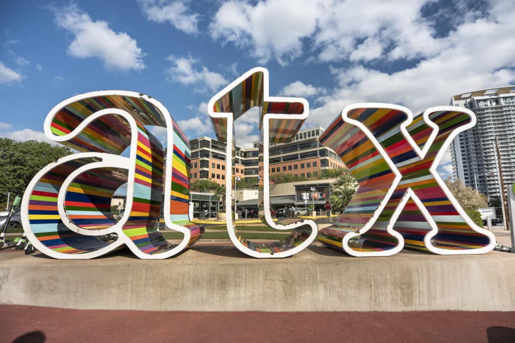 Austin Texas USA street sign reading "atx"