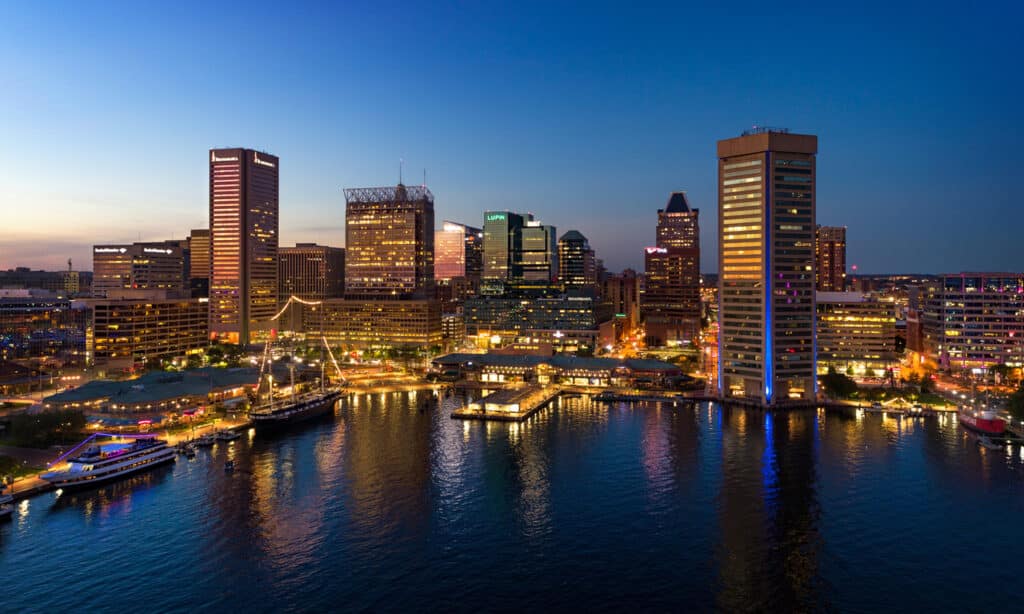 Baltimore Skyline And Inner Harbor Aerial At Dusk