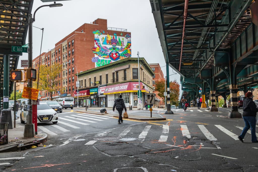 Street under elevated subway tracks in The Bronx.