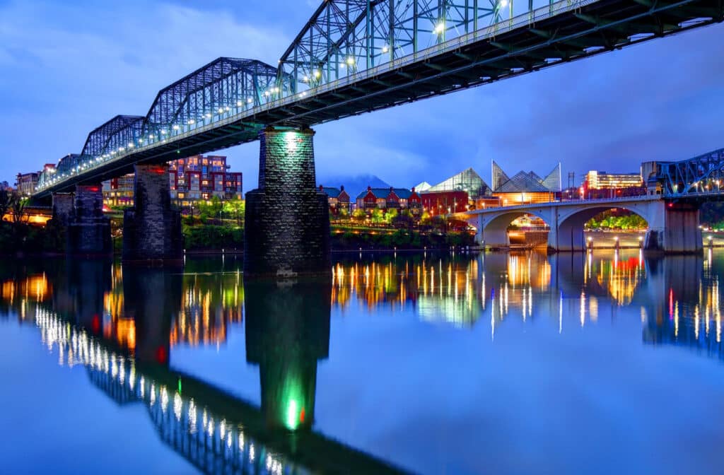 Chattanooga downtown skyline under the Walnut Street Bridge at night. The Historic Walnut Street Bridge, which is now the world's longest pedestrian bridge.