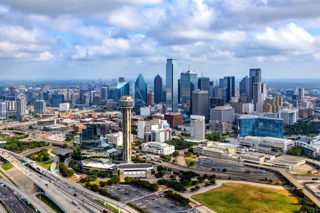 The beautiful modern skyline of Dallas, Texas shot aerially from an altitude of about 800 feet.