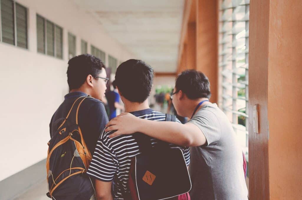 two students with their dads