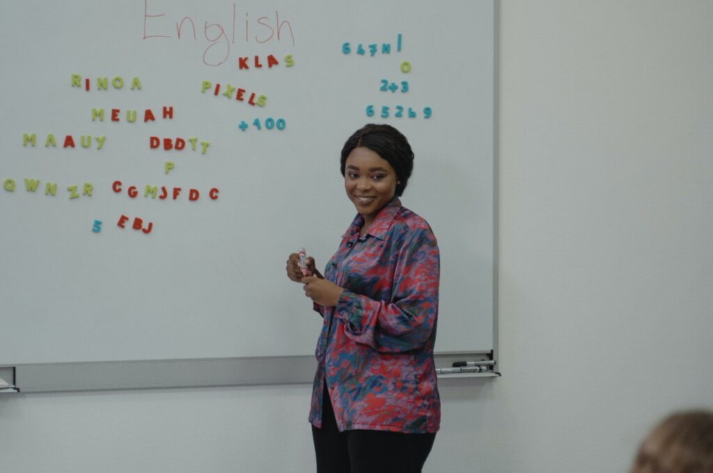 women teaching English to students