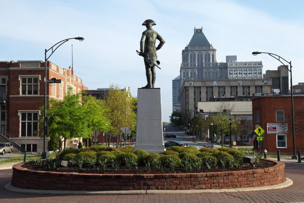 A statue of General Nathanael Greene at Holiday Circle in Greensboro NC overlooking downtown. 