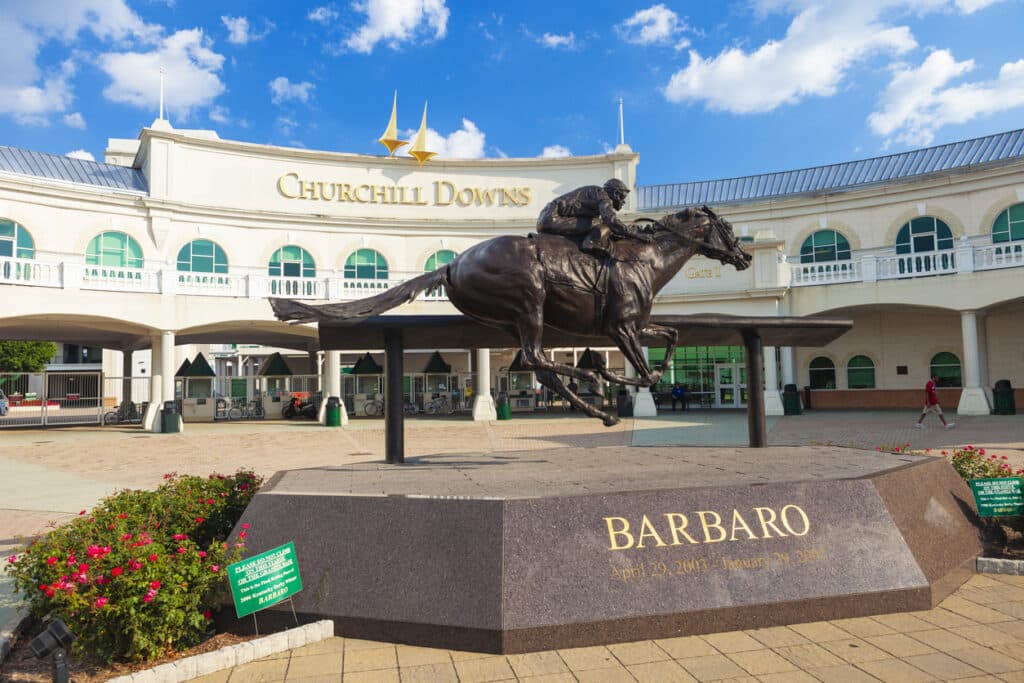 Churchill Downs In Louisville, Kentucky with a statue of a horse racer 