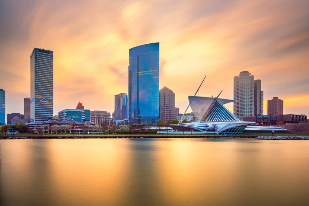 Milwaukee, Wisconsin, USA downtown city skyline on Lake Michigan at twilight.