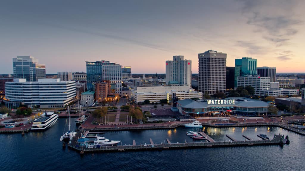Aerial shot of Downtown Norfolk, Virginia from over the Elizabeth River at sunrise.