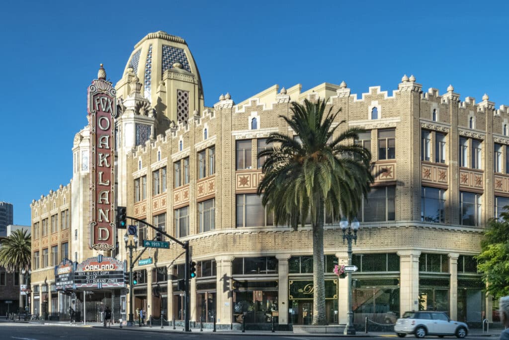 The morning sun rises on the iconic Fox Oakland Theatre, a concert hall and former movie theater in Downtown Oakland.