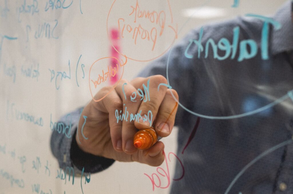 man planning a hackathon on whiteboard